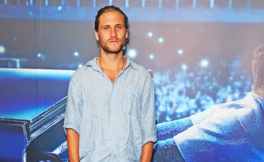 George Mason, wearing a blue shirt