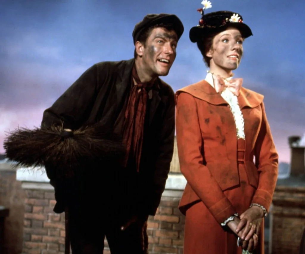 A man and a woman in Edwardian clothes, with soot smudges