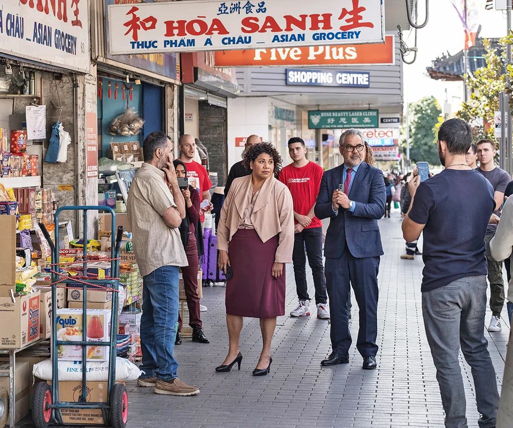 Deb, in character on Total Control, walks down a suburban street