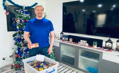 Brian M Logan with Christmas Hamper. (Image: Supplied)