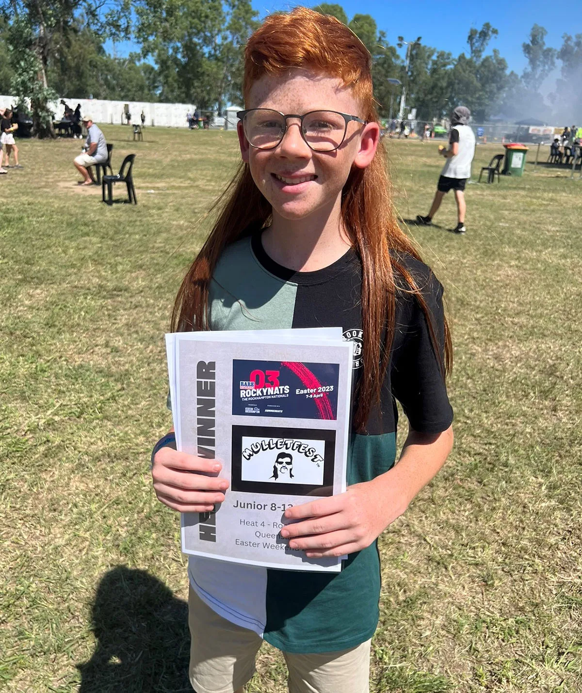 Jayce with his award from winning Rocky Mullet Fest. (Image: Supplied)