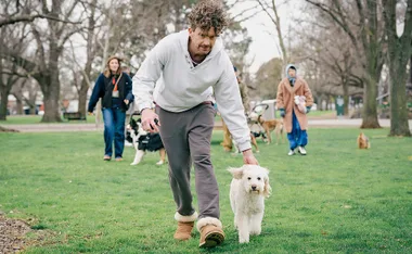 Roland and dog Beattie in Dog Park.