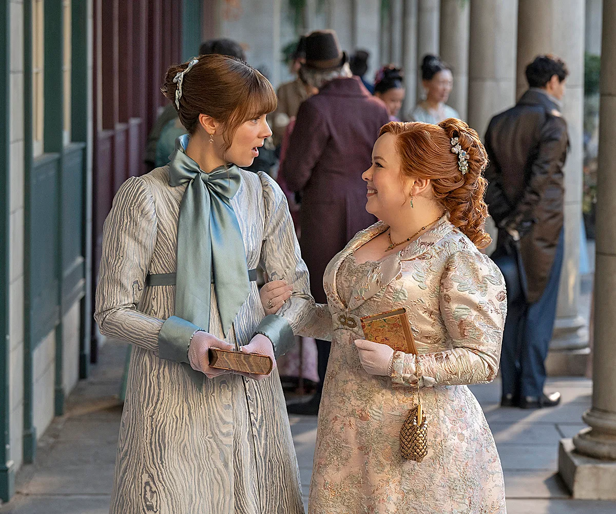 Claudia Jessie as Eloise Bridgerton (left) and Nicola Coughlan as Penelope Featherington.