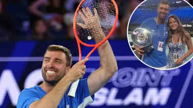 A man holding a tennis racquet