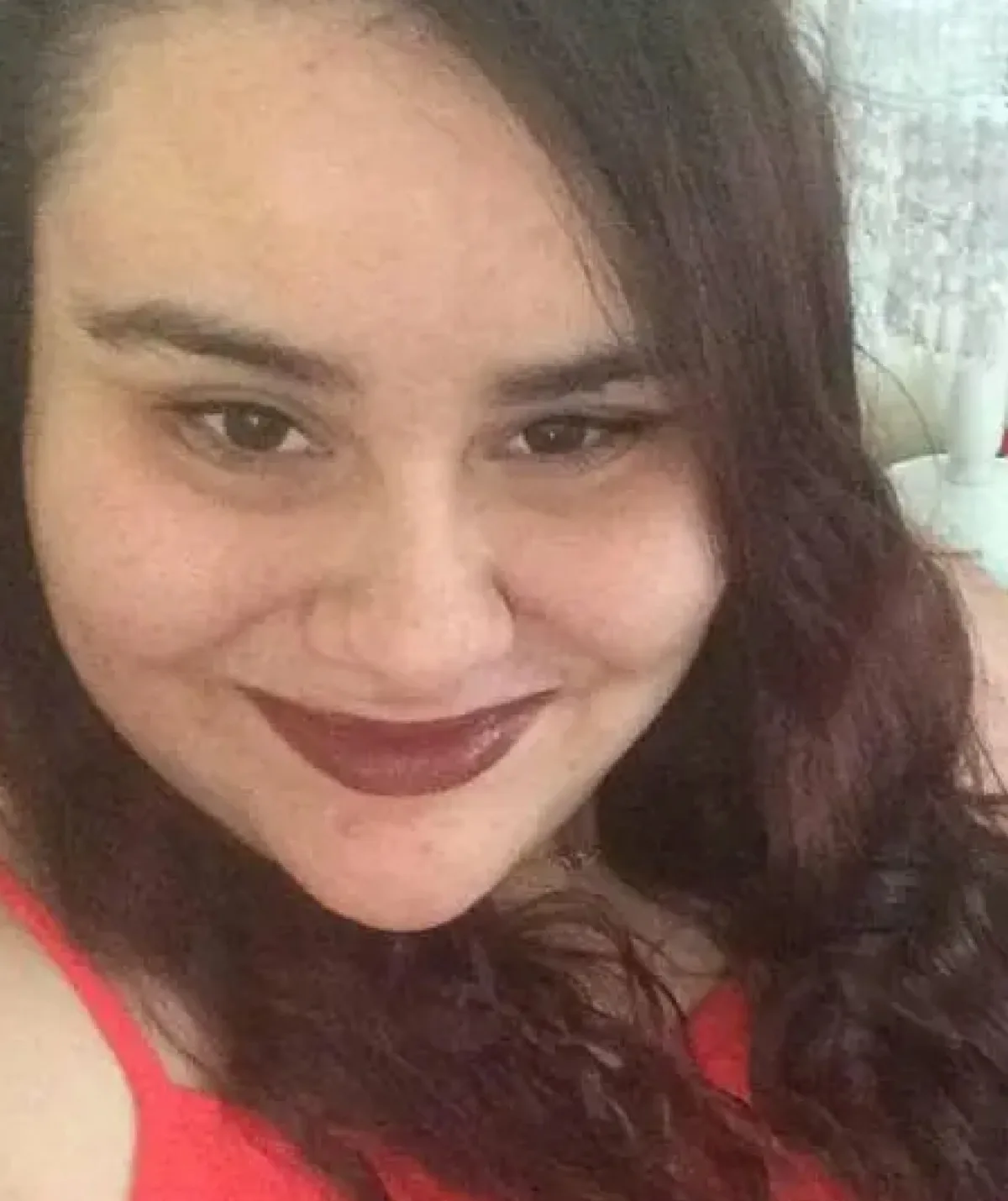 A woman smiles to camera