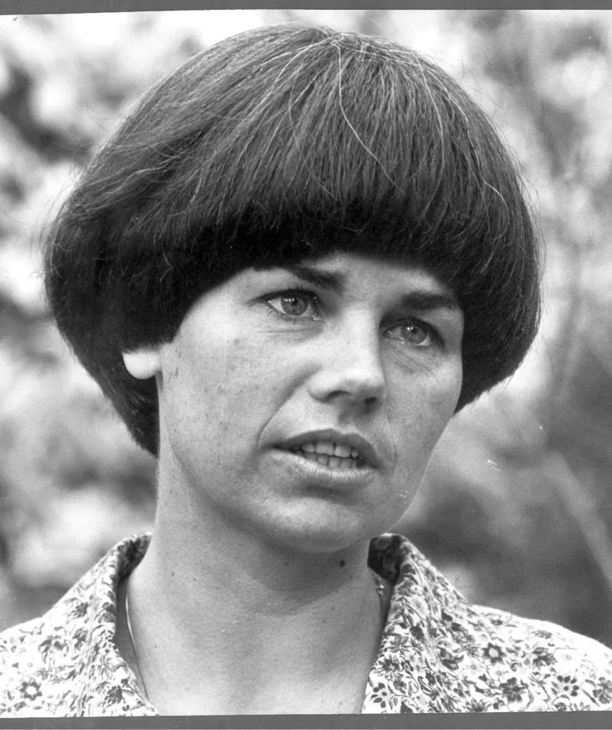 A black and white image of a woman in the 70s