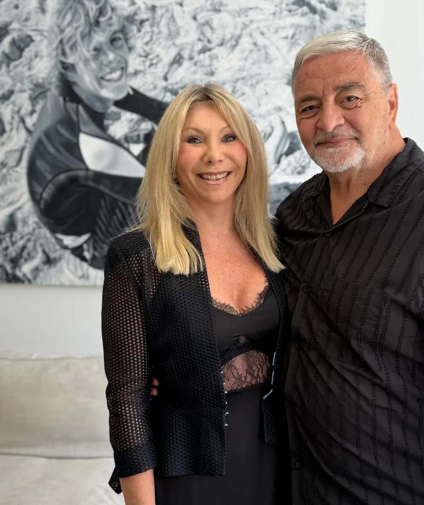 A man and woman smiling