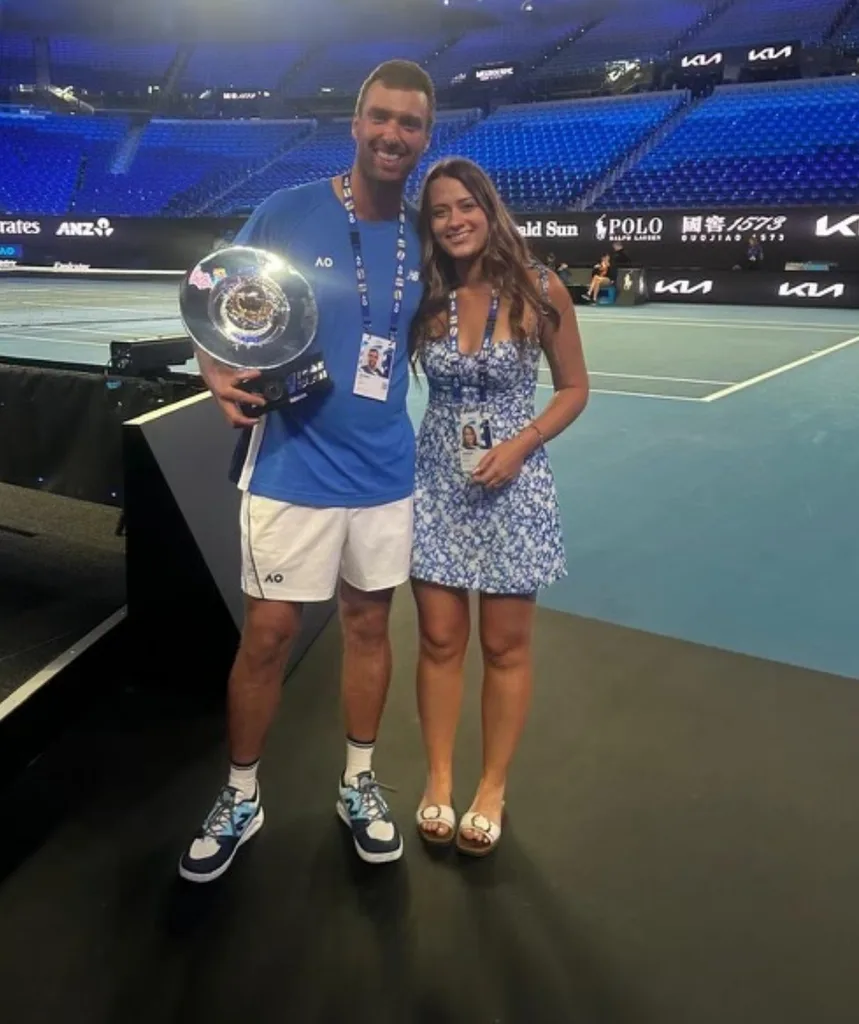 A man and woman on a tennis court