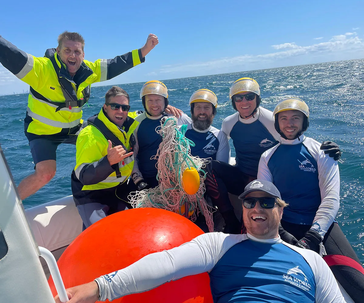 Me (front) celebrating with the Sea World Foundation team following a successful whale rescue operation off the Gold Coast. (Image: Supplied)
