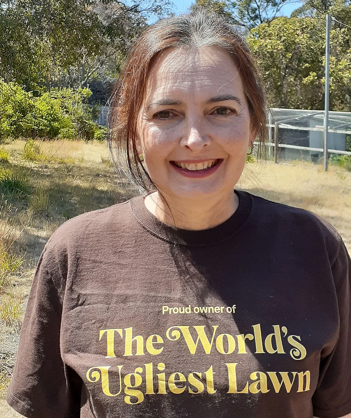 Me wearing my prized hand-me-down shirt which I need to regift to next years winner. (Image: Supplied)