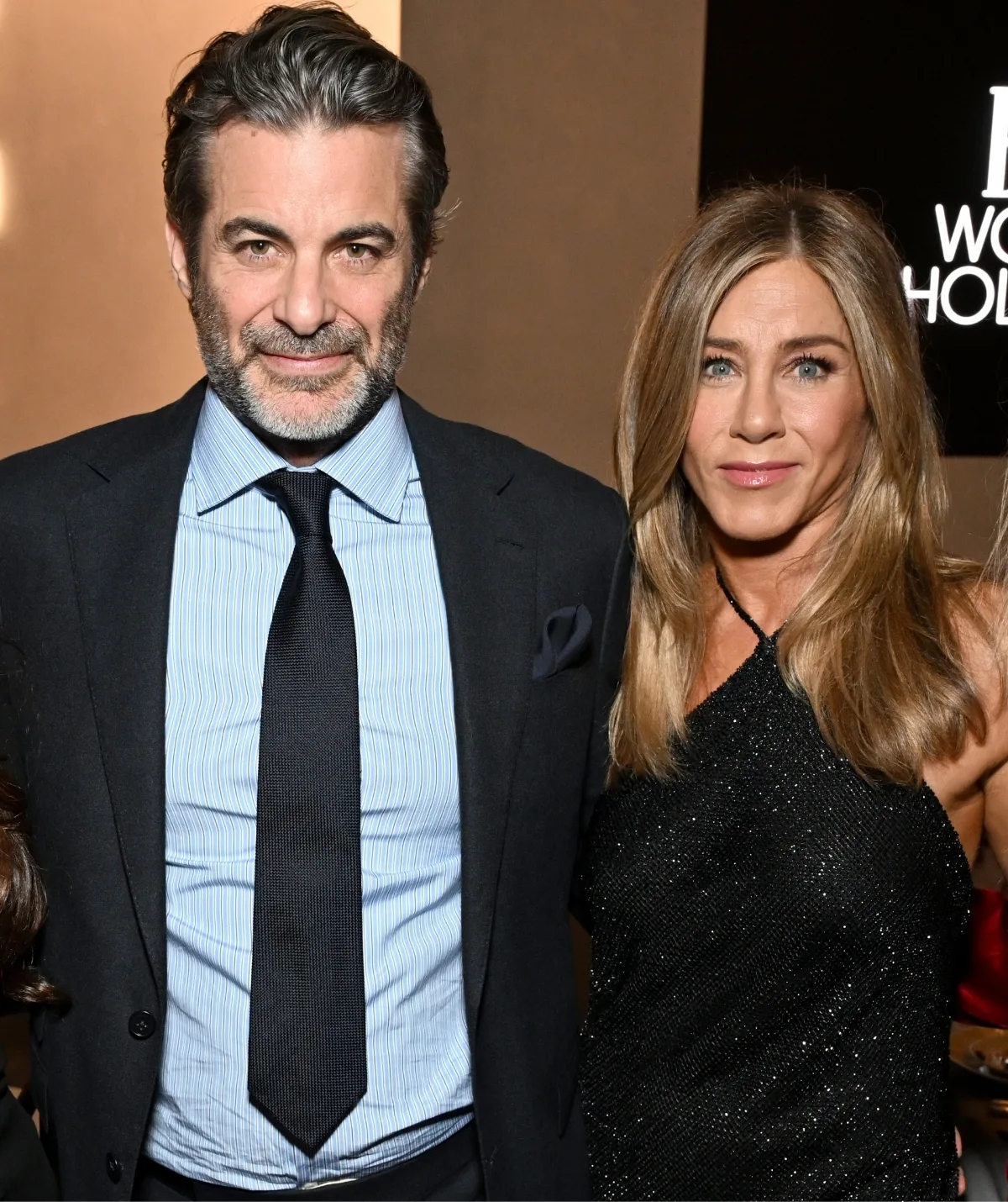 Jennifer Aniston supported by her partner, Jim Curtis