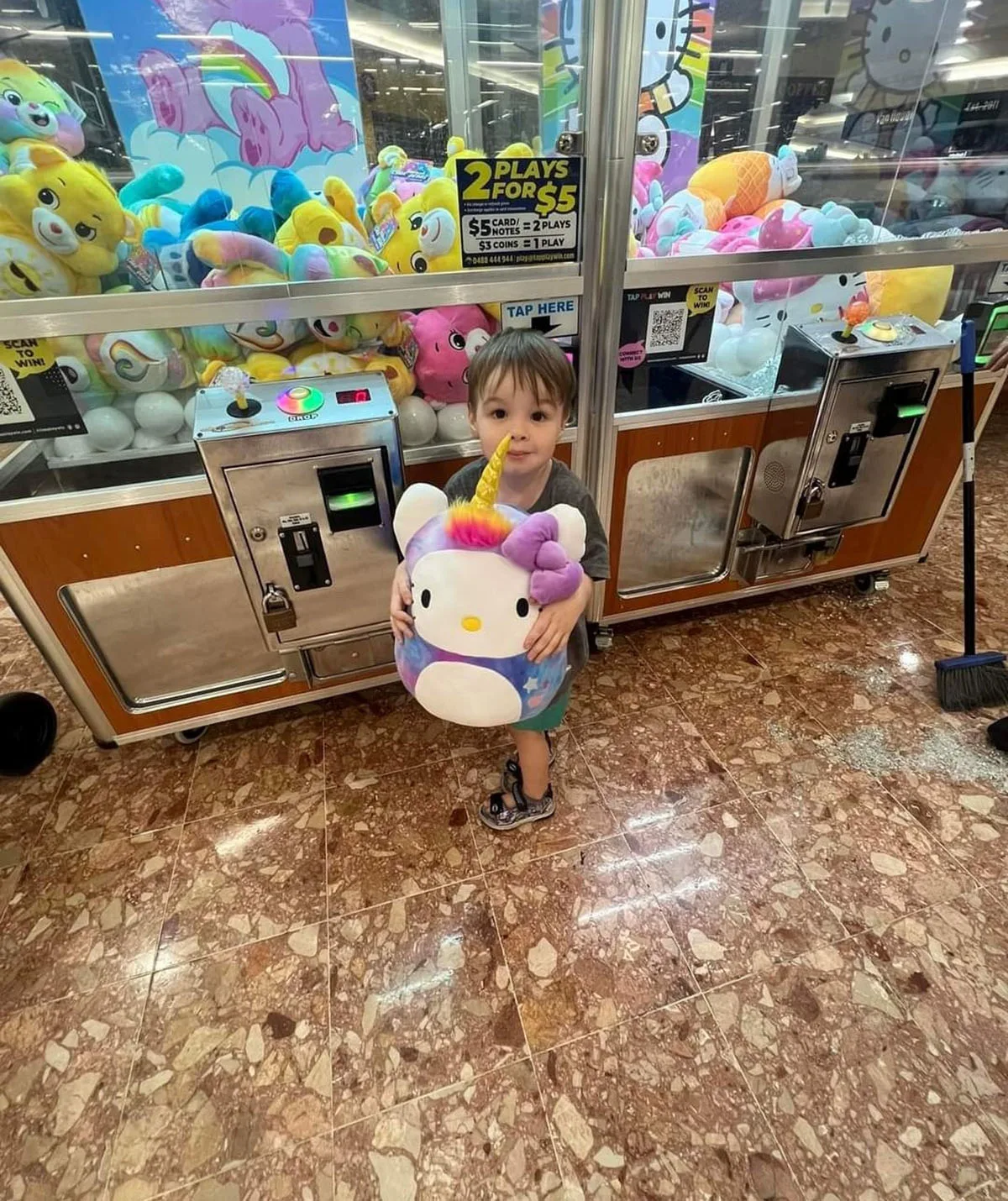 Ethan outside the machine after he was rescued. This was the toy offered to him but we didn't let him keep it, as he'd been naughty. (Image: Supplied)