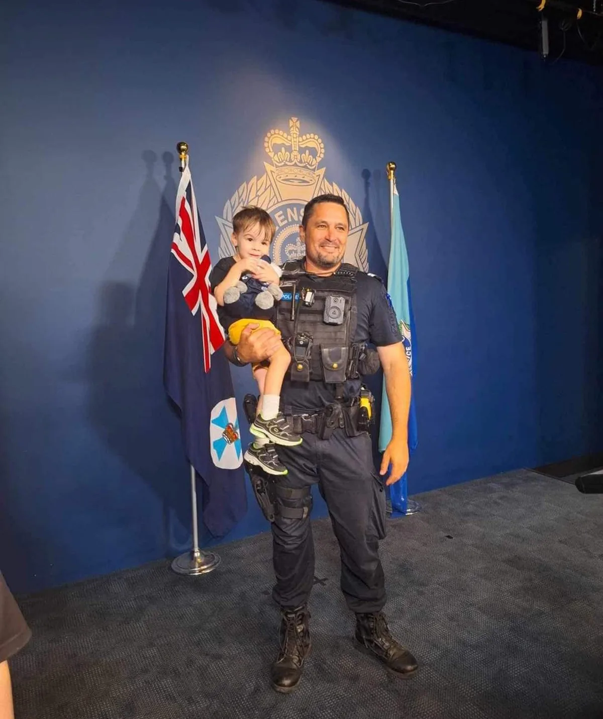 Ethan with Senior Constable Stewart Power who helped rescue him from the toy machine. (Image: Supplied)