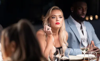 Alissa from MAFS at the Dinner Party table next to husband David.