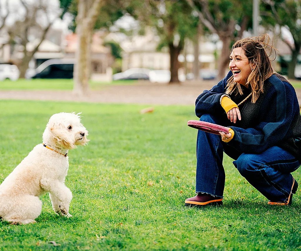 Celia as Samantha with dog Beattie in Dog Park.