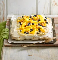 Pavlova with custard cream, mango & blueberries