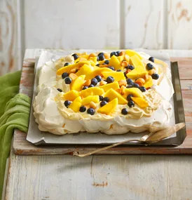 Pavlova with custard cream, mango & blueberries