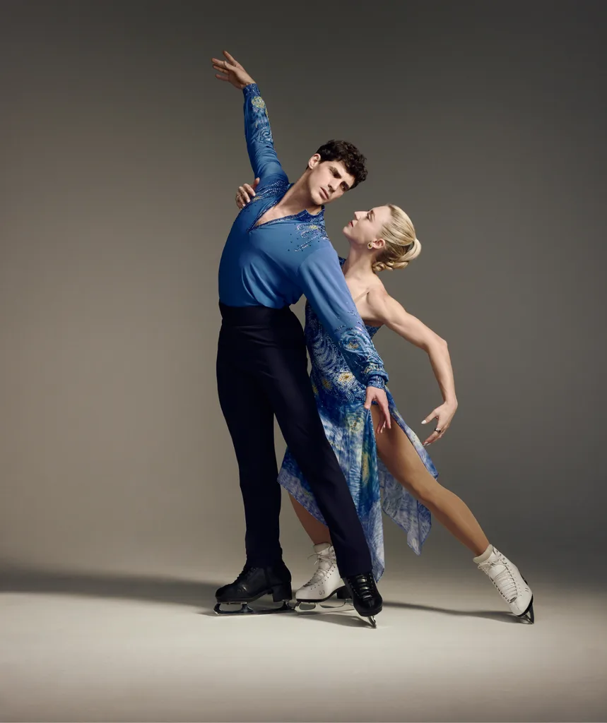 Piper and Paul posing in ice skating uniform