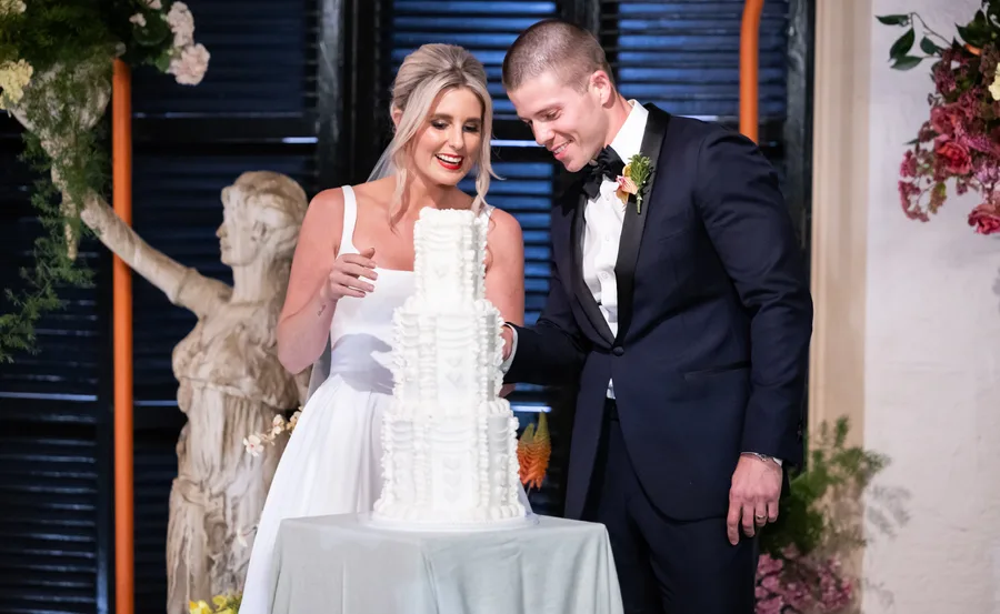 MAFS' Tyson cutting the cake with his bride Stephanie on their wedding day.