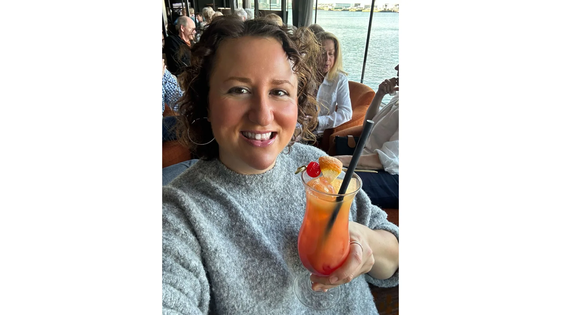 The author enjoys a fruity beverage during happy hour.