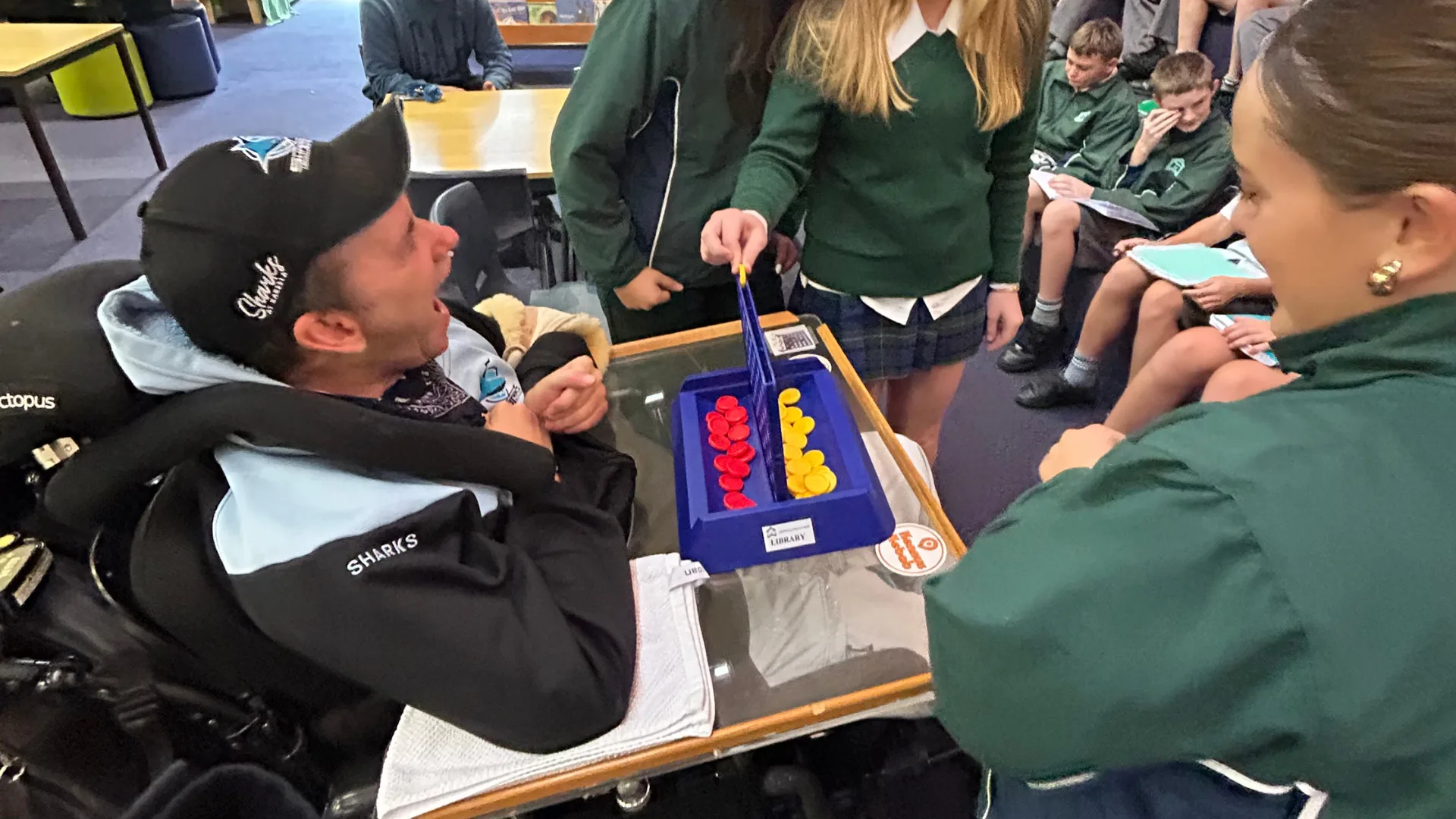 James winning Connect Four against the students.
