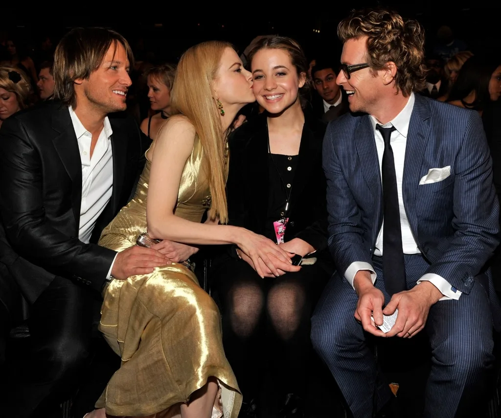 Keith, Nicole, Simon's daughter Olivia and Simon in happier times.