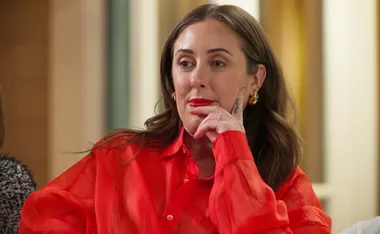 MAFS Rachel in a red shirt at the retreat looking unimpressed by Bec's comment.