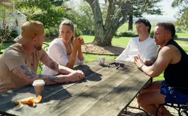 Sam sitting at an outdoor table with husband Chris and Bec and Danny on Married at First Sights Retreat Week.