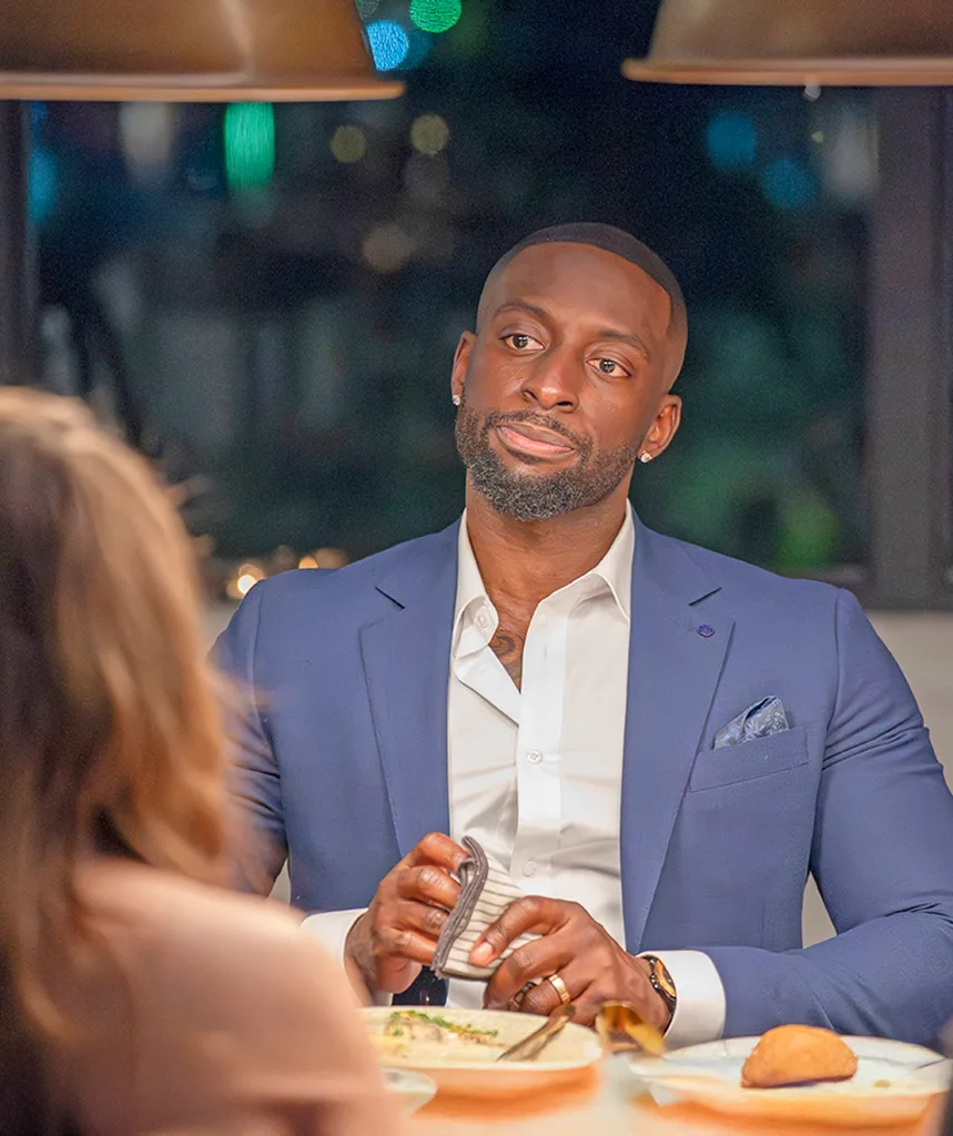 David in a navy suit at the MAFS dinner party.