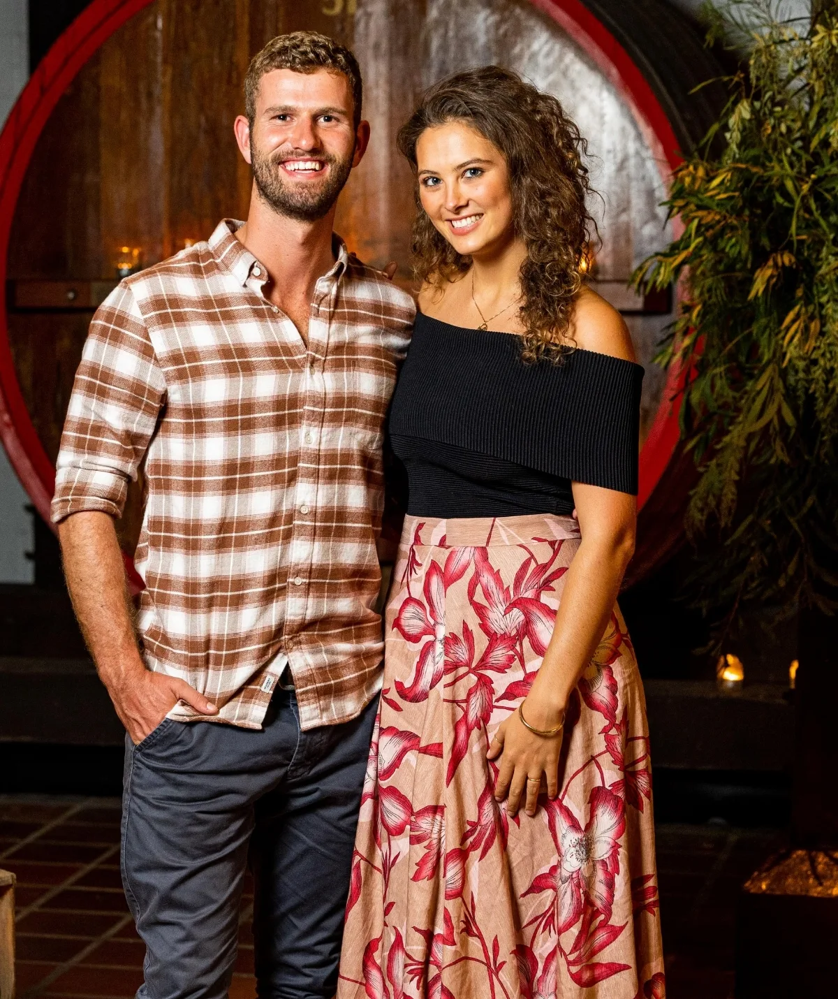 A man and a woman stand side by side