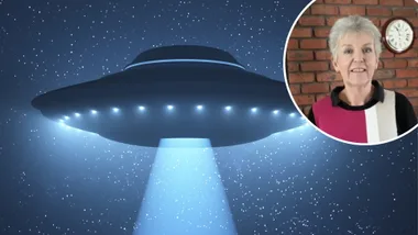 A flying saucer and a woman looking to camera next to it