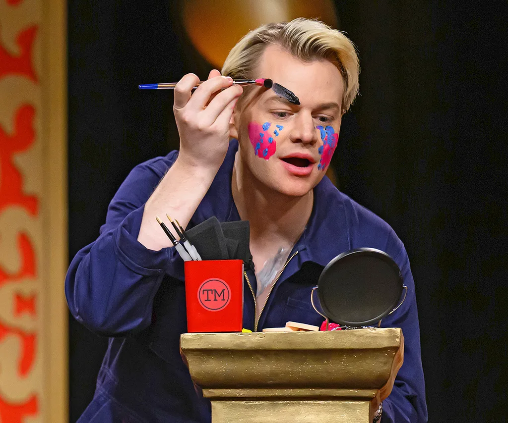Joel applies makeup on the set of Taskmaster