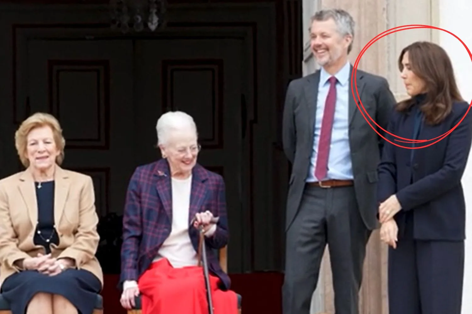 Queen Mary looks chastised after Queen Margrethe speaks to her
