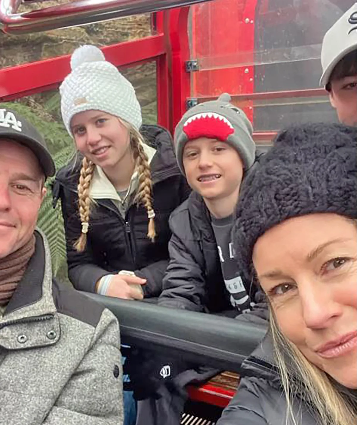 Rodger, his wife and children, all wearing beanies