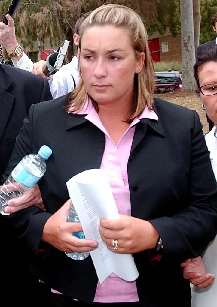 An image of a woman looking solemn.