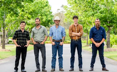 Farmers Alex, Jarrad, Dylan, Zac and Jason stand next to each other on the road