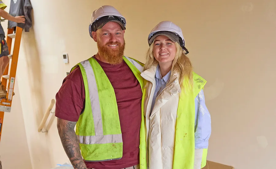 Mitch and Shaz from My Reno Rules in hi-vis on set.