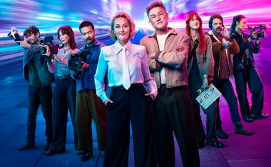 Zan Rowe and John Safran stand in front of the cast of Race Around The World