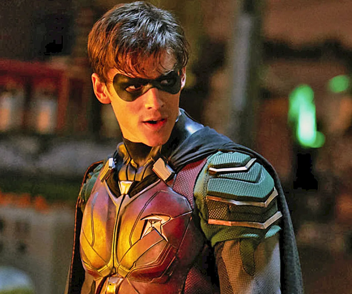 Brenton in character, wearing a mask over his eyes, on the set of Titans