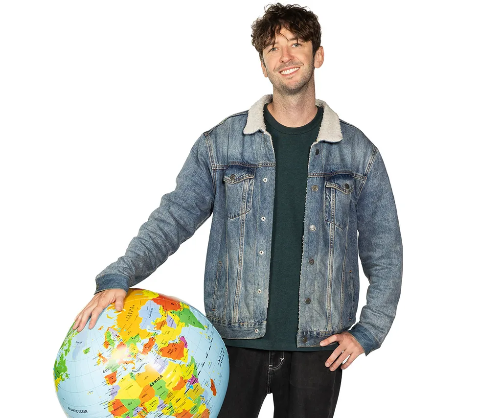 Elliot, in a blue jacket, holds the world in one hand.