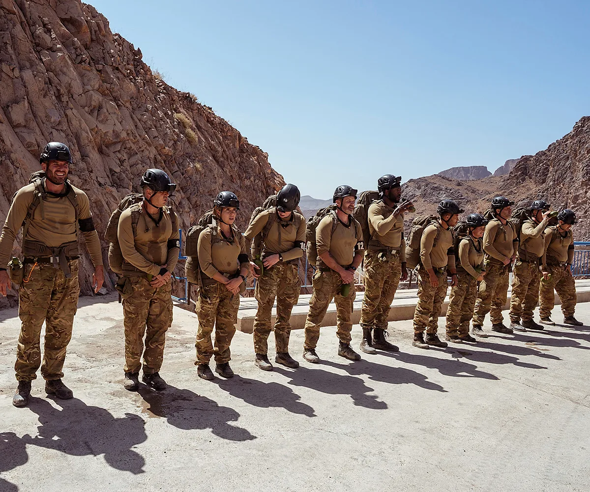 Pictured: All recruits lined up in helmets at top of dam before Double Drop Rappel on SAS: Australia vs England. 