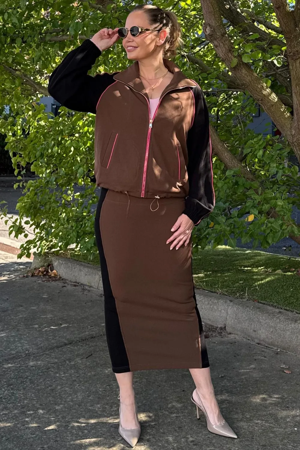 Jelena Dokic beams as she wears Motto's Chocolate Contrast Miracle Skirt and matching top