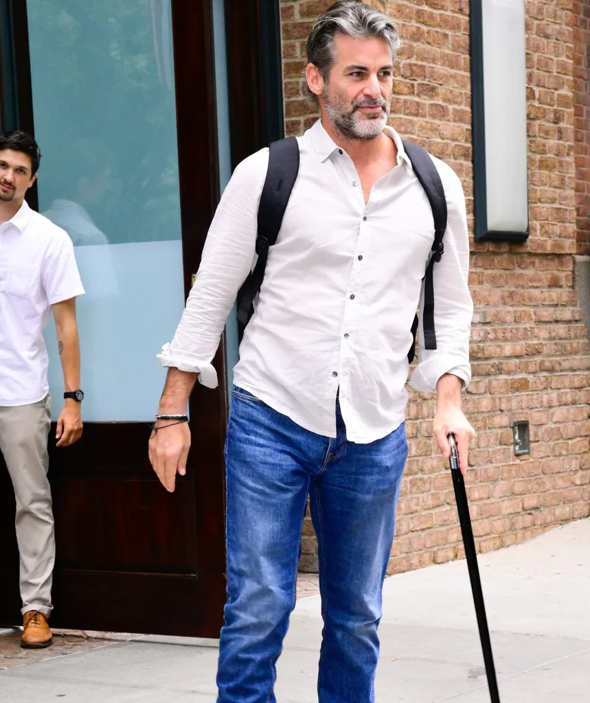 A man standing with a walking stick