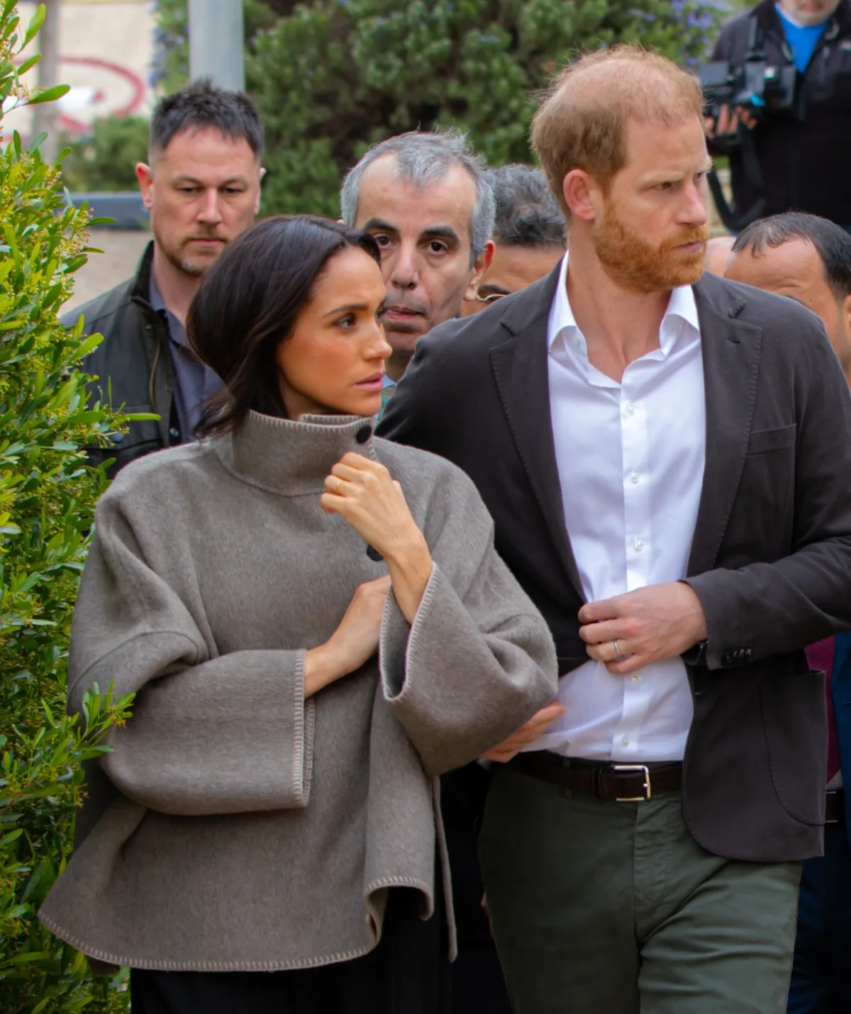 Meghan wants her show her kids off to the world, but Prince Harry is worried about their security. (Getty)