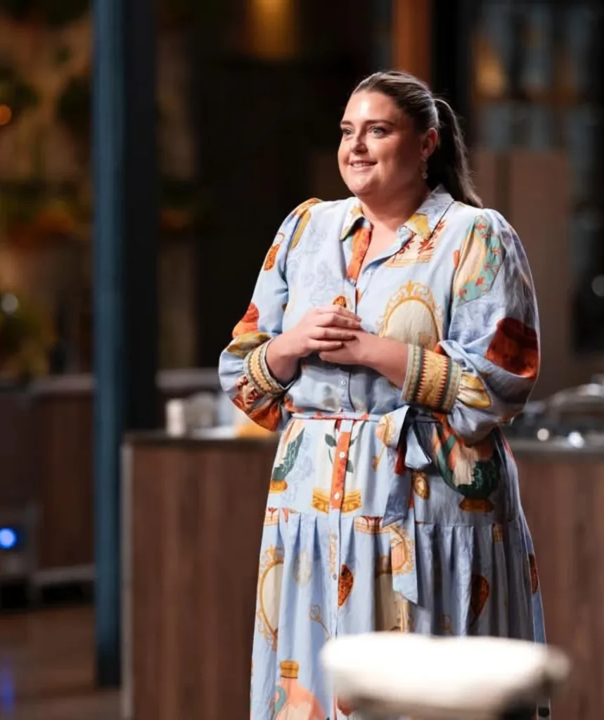 Dot McHugh smiling in the MasterChef Australia kitchen.