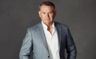 Michael Usher poses in a suit.