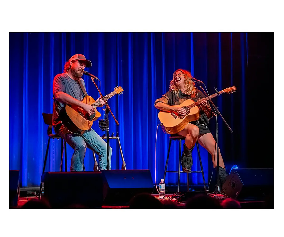 Adam and Brooke on stage.