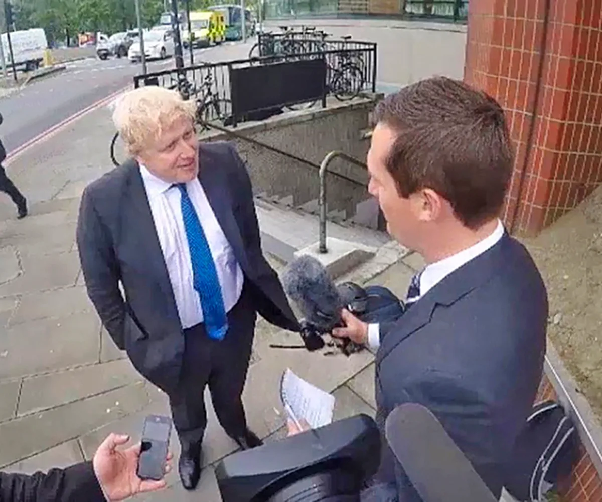 James chats to British politician Boris Johnson in the street