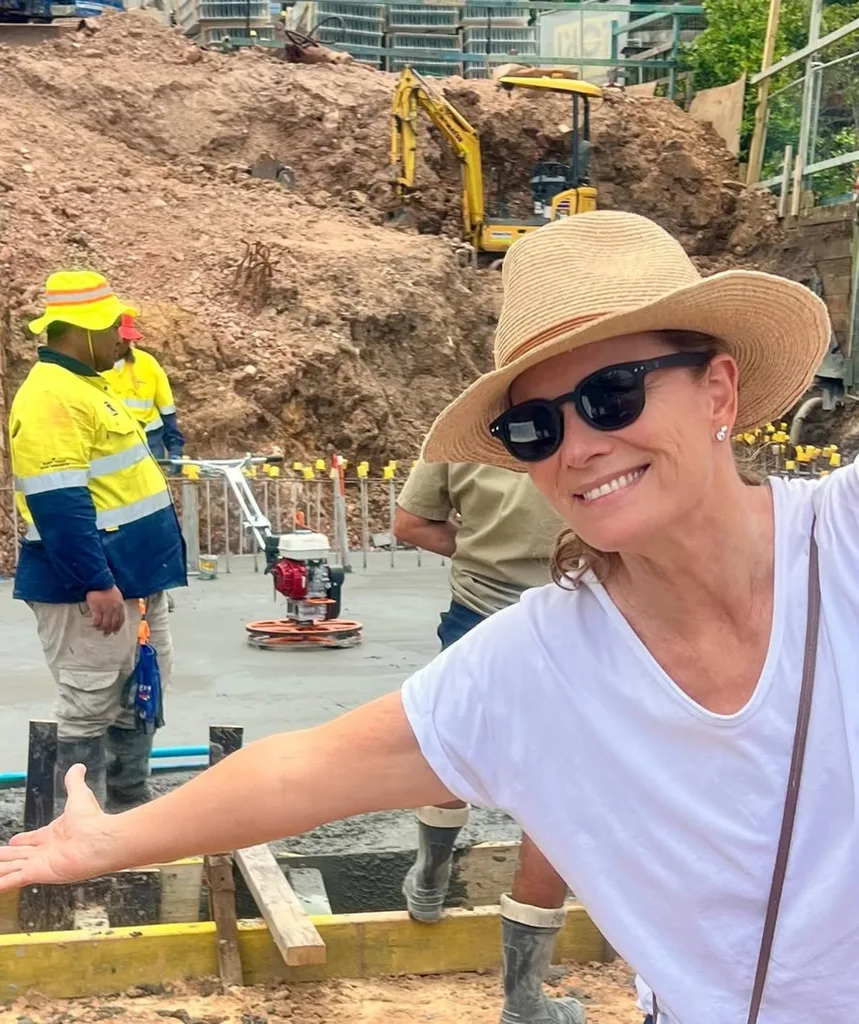 A woman in front of a building site