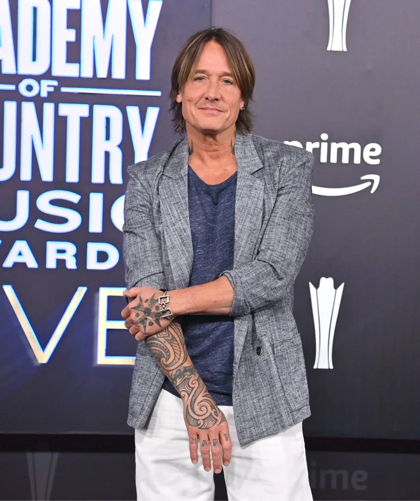 A middle aged man with tattoos